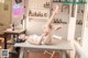 A woman laying on top of a table in a room.