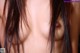 A close up of a woman's face with long black hair.